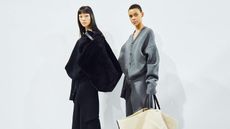 Two women on white background wearing Loewe at Paris Fashion Week A/W 2023