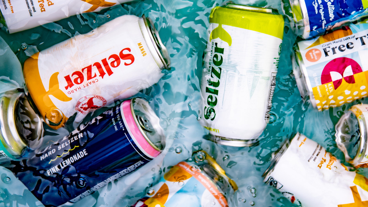 Cans of hard seltzer in water. 