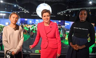 COP26: Scotland's First Minister Nicola Sturgeon poses for a photograph during her meeting with climate activists Vanessa Nakate (R) and Greta Thunberg during the COP26 UN Climate Change Conference in Glasgow