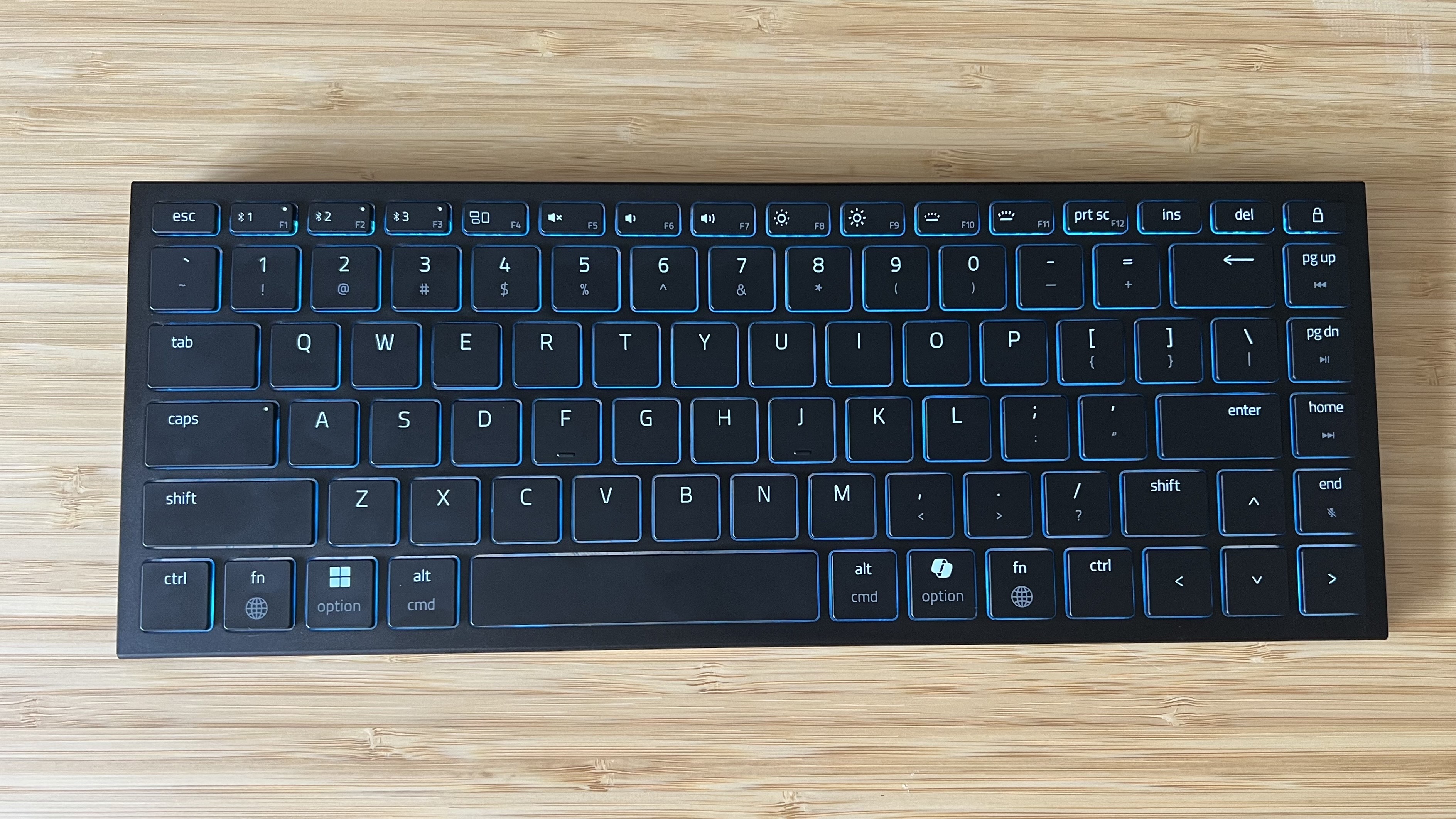 Razer Joro gaming keyboard on a wooden desk