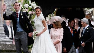 Pippa Middleton and James Matthews smile for the cameras after their wedding