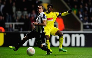 NEWCASTLE UPON TYNE, ENGLAND - MARCH 14: Newcastle player Steven Taylor (l) looks on as Samuel Eto shoots wide during the UEFA Europa League Round of 16 second leg match between Newcastle United FC and FC Anji Makhachkala at St James' Park on March 14, 2013 in Newcastle upon Tyne, England. (Photo by Stu Forster/Getty Images)