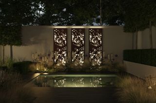 illuminated trellis in a garden