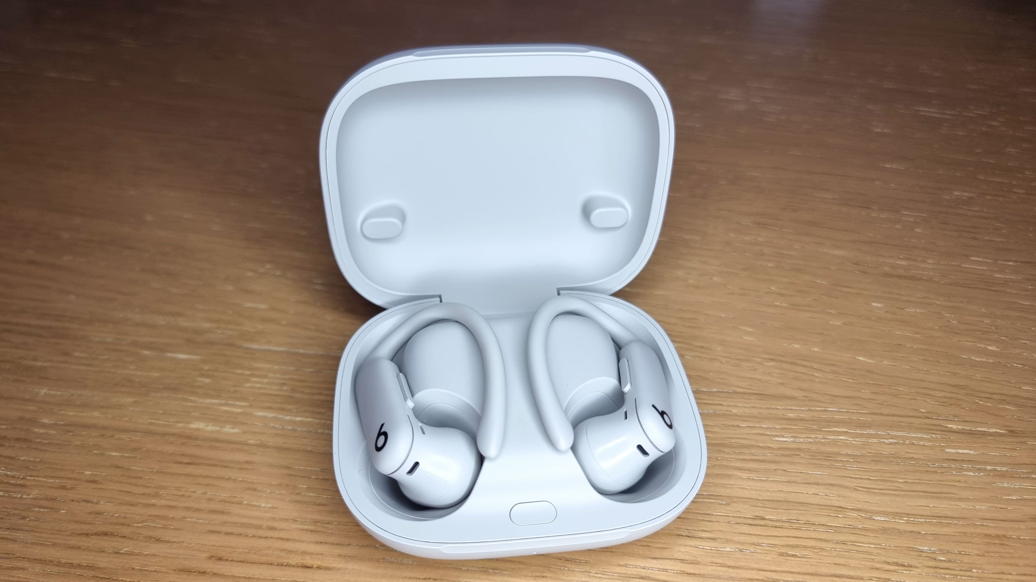 a picture of the Beats Powerbeats Pro 2 earbuds inside the charging case