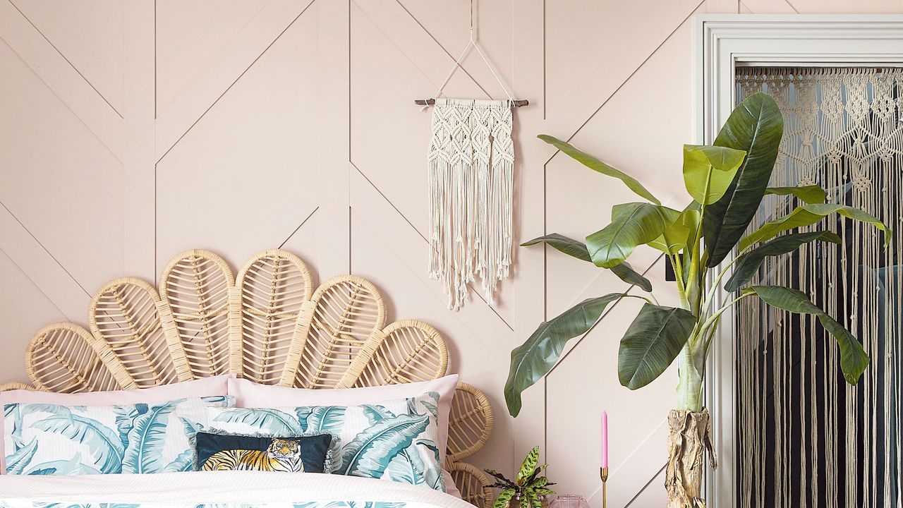 Rattan headboard in front of pink bedroom wall panelling ideas