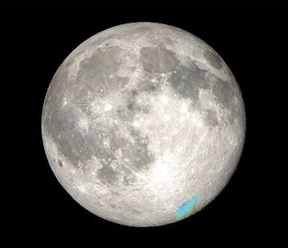 a photograph of the moon's surface showing a blue area near the lunar south pole