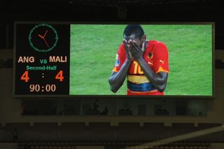 Angola's Francisco Zuela reacts on the big screen after his team throw away a 4-0 lead to draw 4-4 with Mali at the 2010 Africa Cup of Nations.