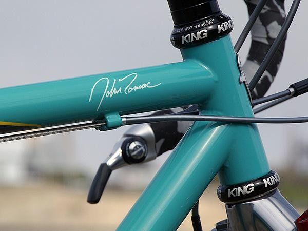 The only branding on the bike is Tomac's signature on the top tube and the usual head tube badge.