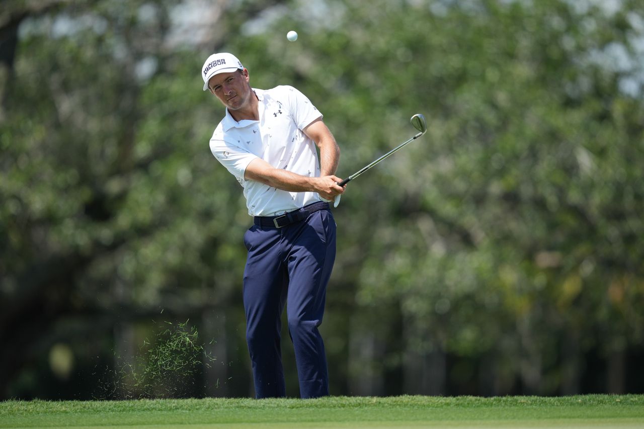 Jordan Spieth plays a shot onto the second green during the first round of Cadillac Championship at Trump National Doral - Blue Monster Course