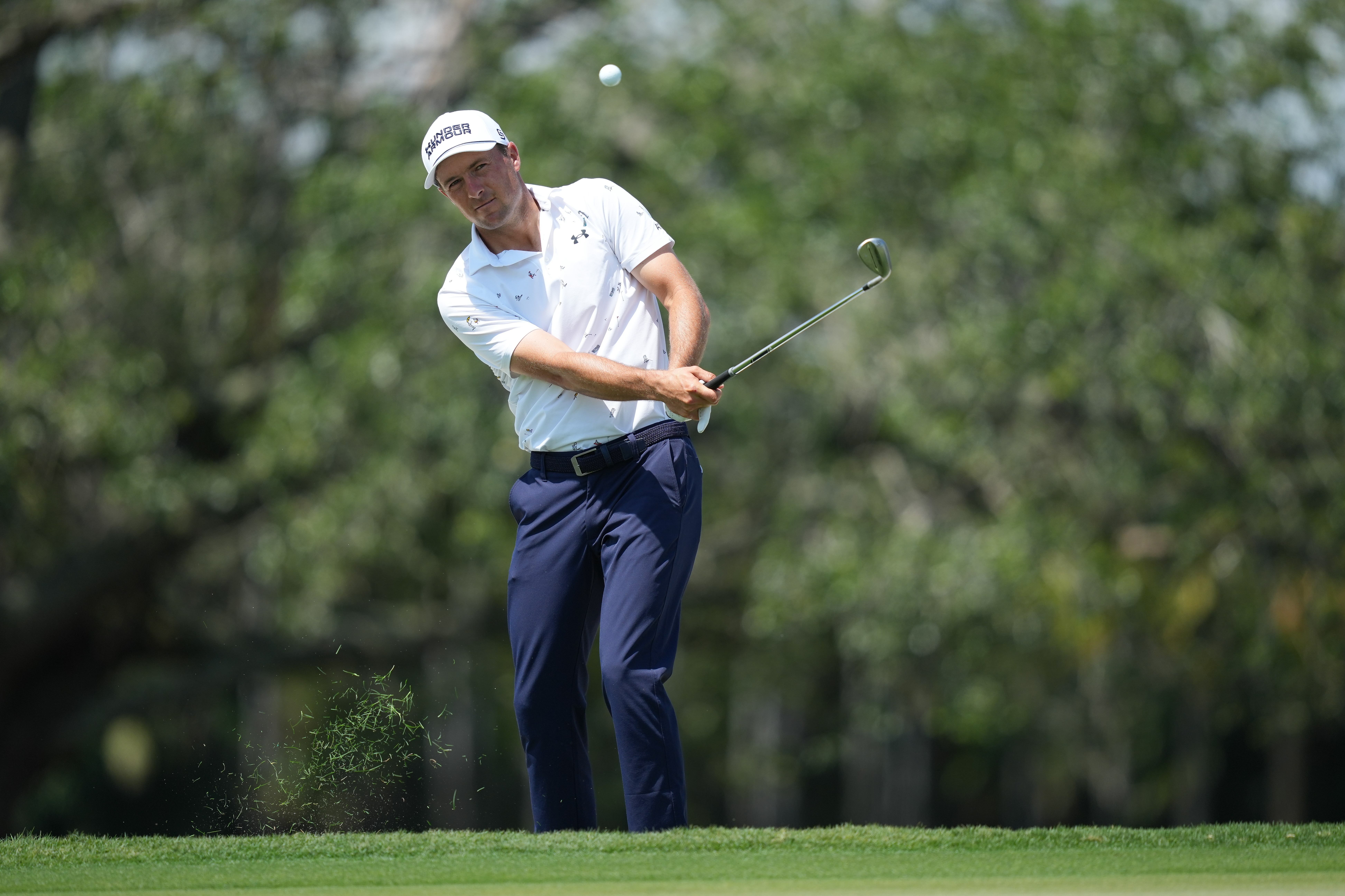 Jordan Spieth plays a shot onto the second green during the first round of Cadillac Championship at Trump National Doral - Blue Monster Course