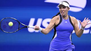 Jessica Pegula hits a backhand at the 2024 US Open tennis in a purple dress.