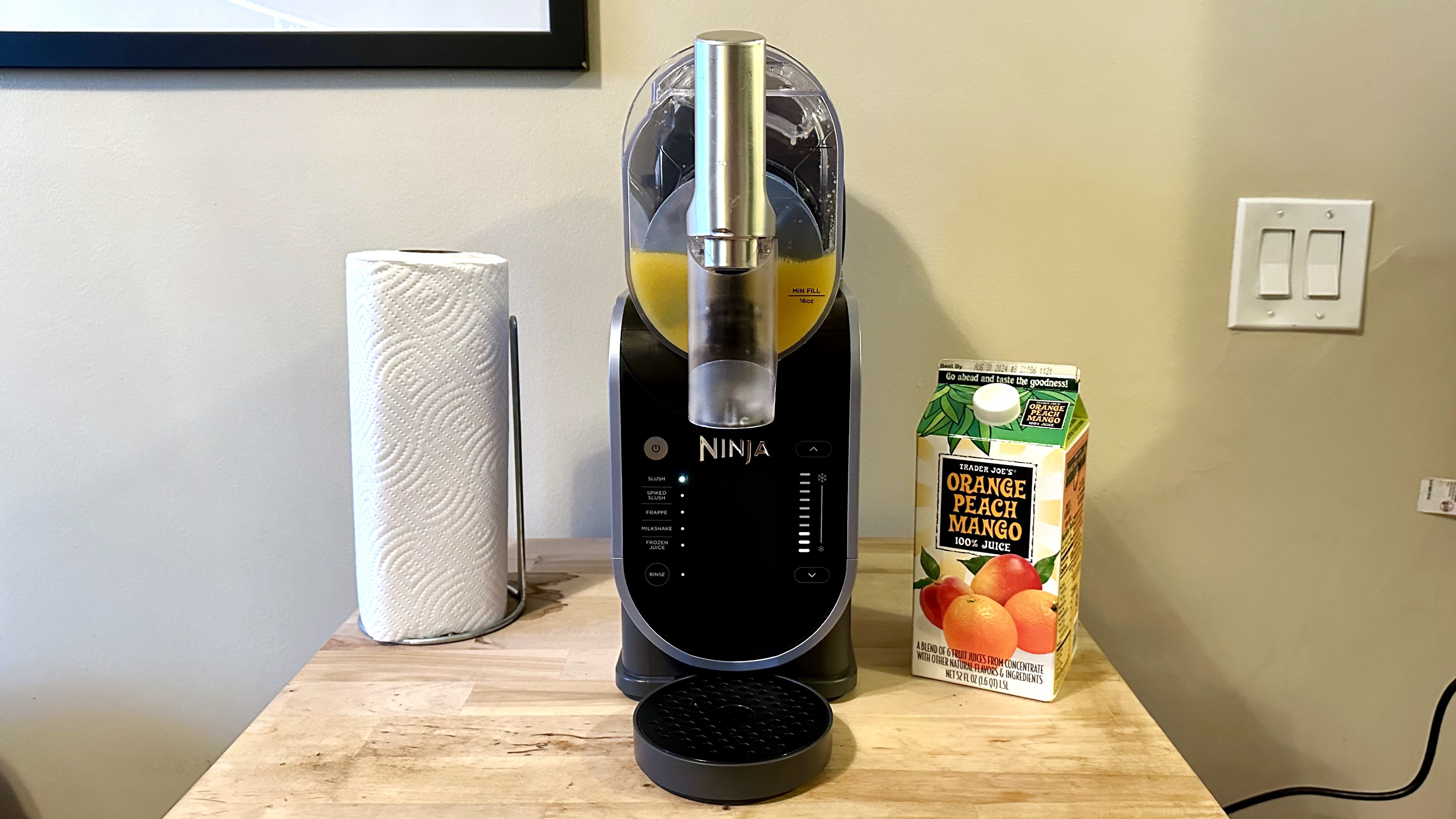 Making an orange juice slushie with Ninja Slushi machine