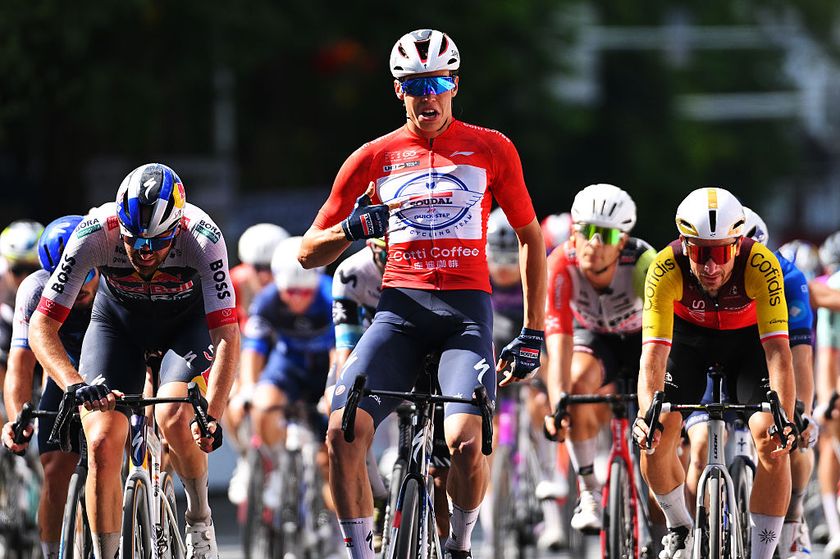 JINGXI, CHINA - OCTOBER 16: Paul Magnier of France and Team Soudal Quick-Step (C) celebrates at finish line as stage winner ahead of Jordi Meeus of Belgium and Team Red Bull - BORA - hansgrohe (L) and Stanislaw Aniolkowski of Poland and Team Cofidis (R) during the 6th Gree-Tour Of Guangxi 2025, Stage 3 a 214km stage from Jingxi to Bama on October 16, 2025 in Jingxi, China. (Photo by Tim de Waele/Getty Images)