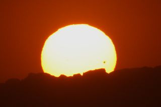 Dena Sparks of Hermosa Beach, Calif., shot this scene of the sun and Venus setting behind the Malibu Mountains from Manhattan Beach on June 5, 2012. Sparks used a Canon EOS 7D DSLR camera and 70–200 mm telephoto lens with a 2x teleconverter.