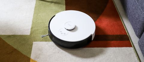 TP-Link Tapo RV30 Plus robot vacuum cleaner on a colorful carpet