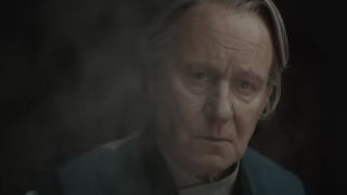 Stellan Skarsgård as Luthen Rael behind a puff of smoke on Andor Season 2