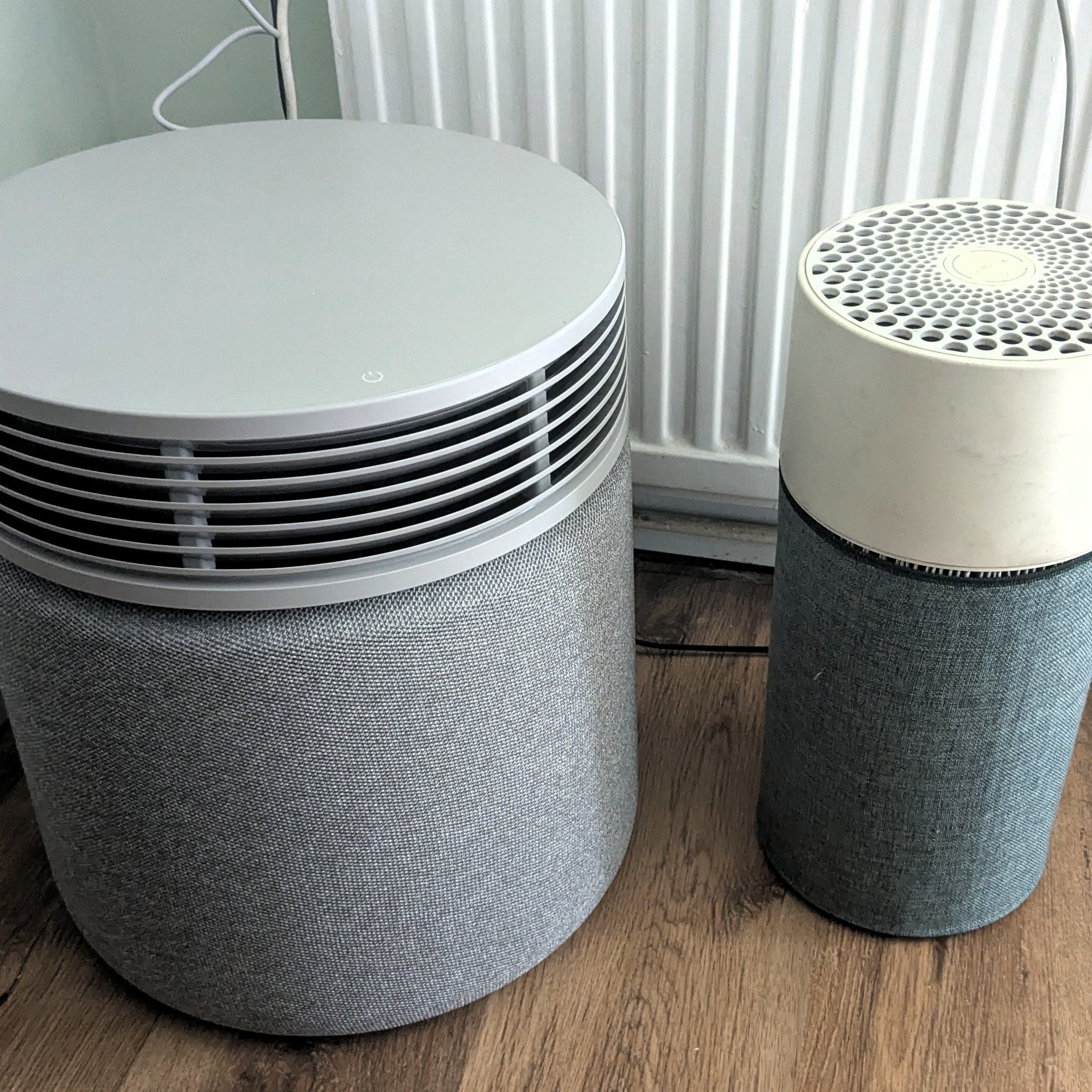 Blueair Blue Signature air purifier pictured next to older model