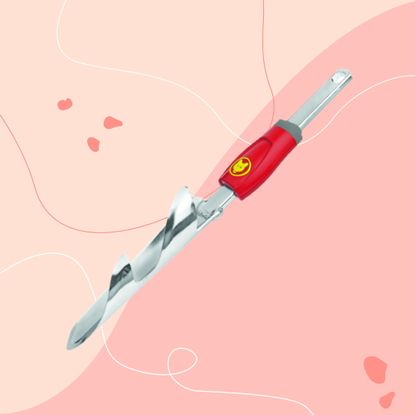 WOLF-Garten Weed Extractor tool on pink background