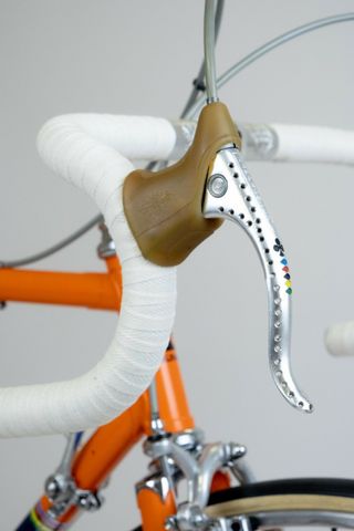 The bike’s Campagnolo Nuovo Record brake levers – drilled, with milled Colnago ace-of-clubs logo and pantograph details