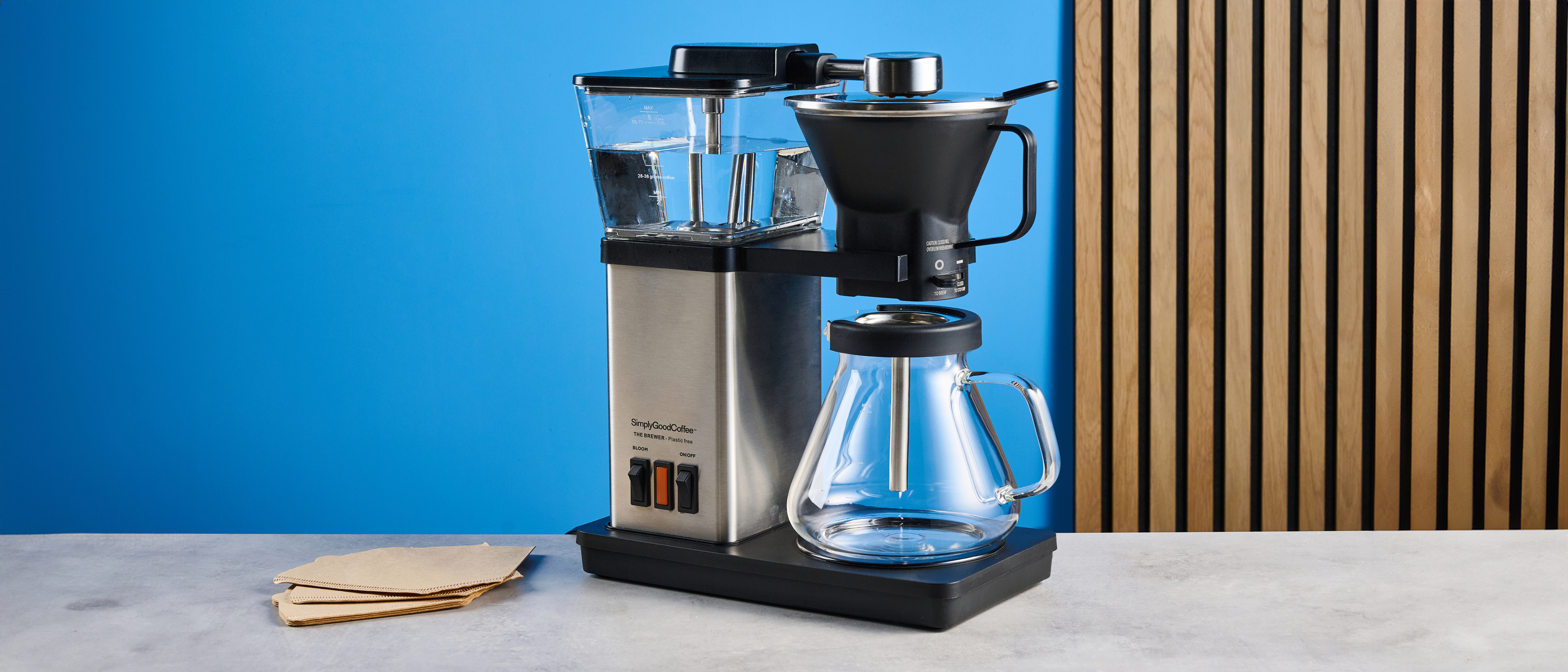 the simply good coffee plastic-free brewer photographed against the blue tom's guide backgrounds