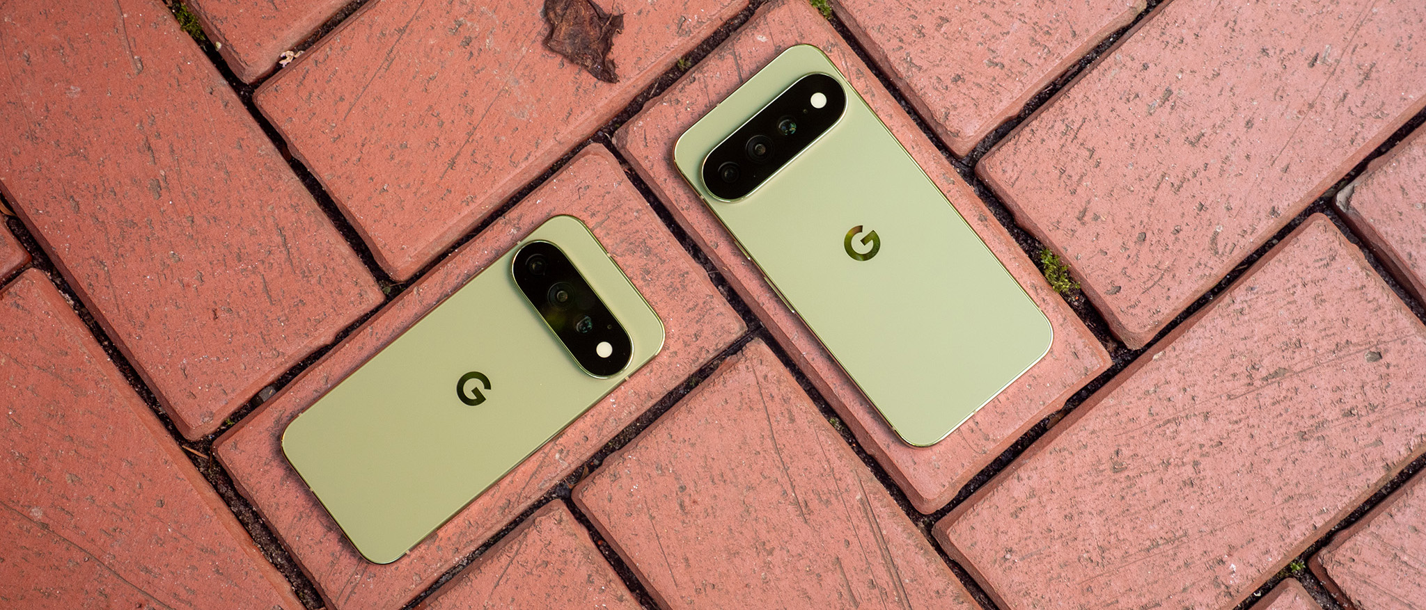 Olive green Google Pixel 11 Pro and Pro XL models on top of bricks