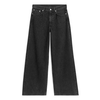 cut out image of dark grey wash jeans from Arket with diamante detail 