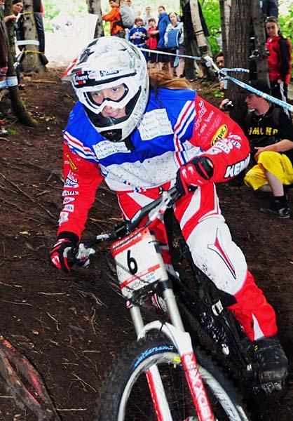 Celine Gros (Morzine-Avoriaz) rides in fourth through the trees.