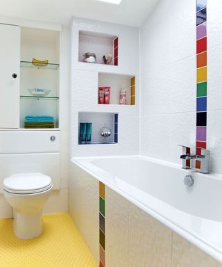 organised bathroom with white tile and glass shelf