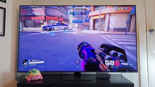 Samsung QN85D with Overwatch 2 gameplay on screen with player playing as Pharah