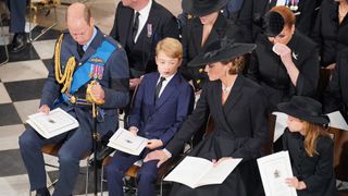 Prince William, Prince of Wales, Prince George of Wales, Catherine, Princess of Wales and Princess Charlotte of Wales during the State Funeral of Queen Elizabeth II