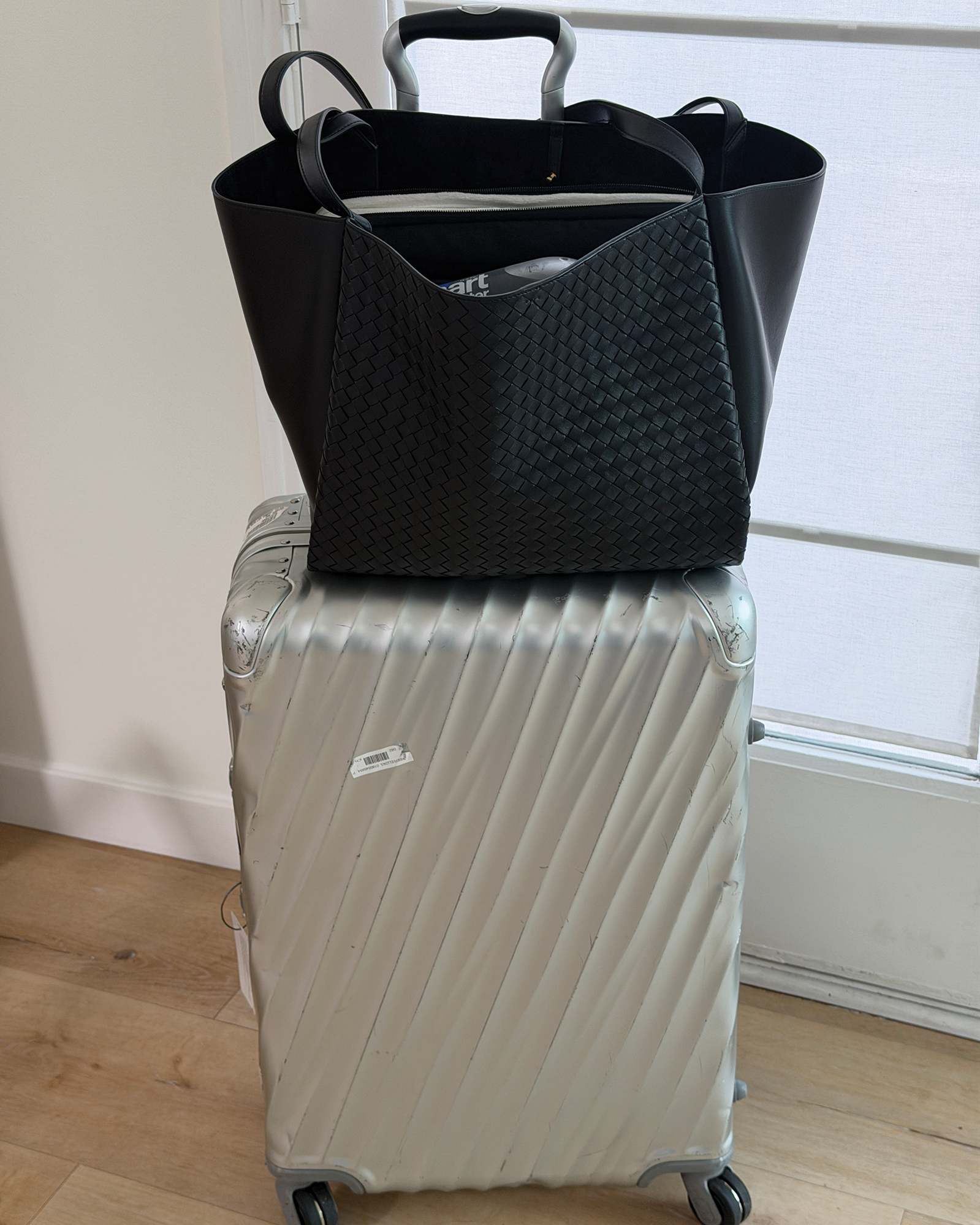 Bottega Veneta's new Corso bag on top of a Tumi suitcase.