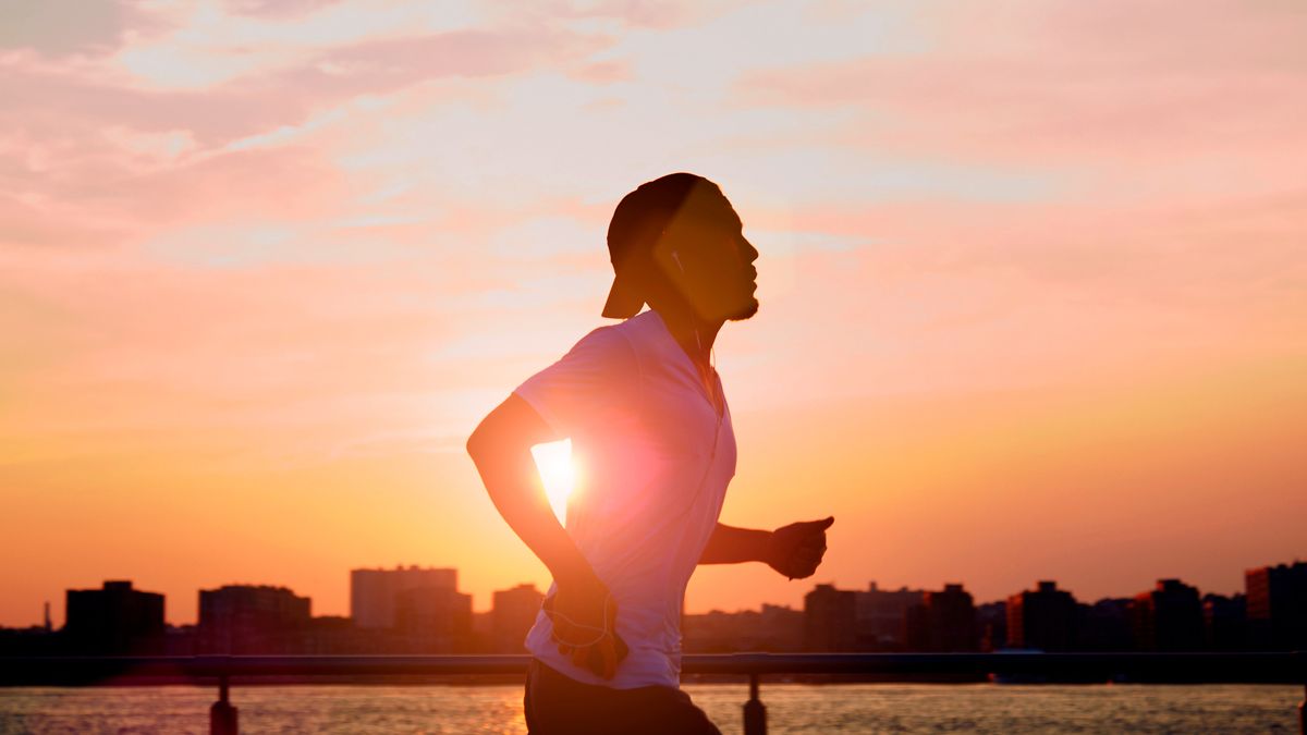 Man running at sunrise