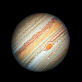 This Hubble Space Telescope view of Jupiter, taken on June 27, 2019, reveals the giant planet's trademark Great Red Spot, and a more intense color palette in the clouds swirling in Jupiter's turbulent atmosphere than seen in previous years. One new study suggest that the gas giant's dilute core was formed by a massive collision billions of years ago. 