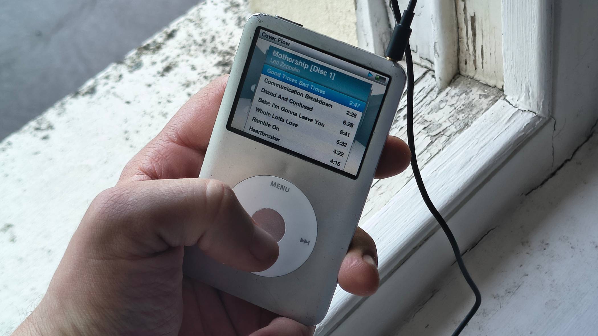 The iPod Classic on a window sill.