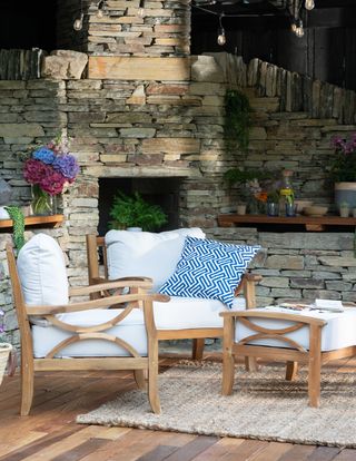 white outdoor chairs with blue patterned cushion