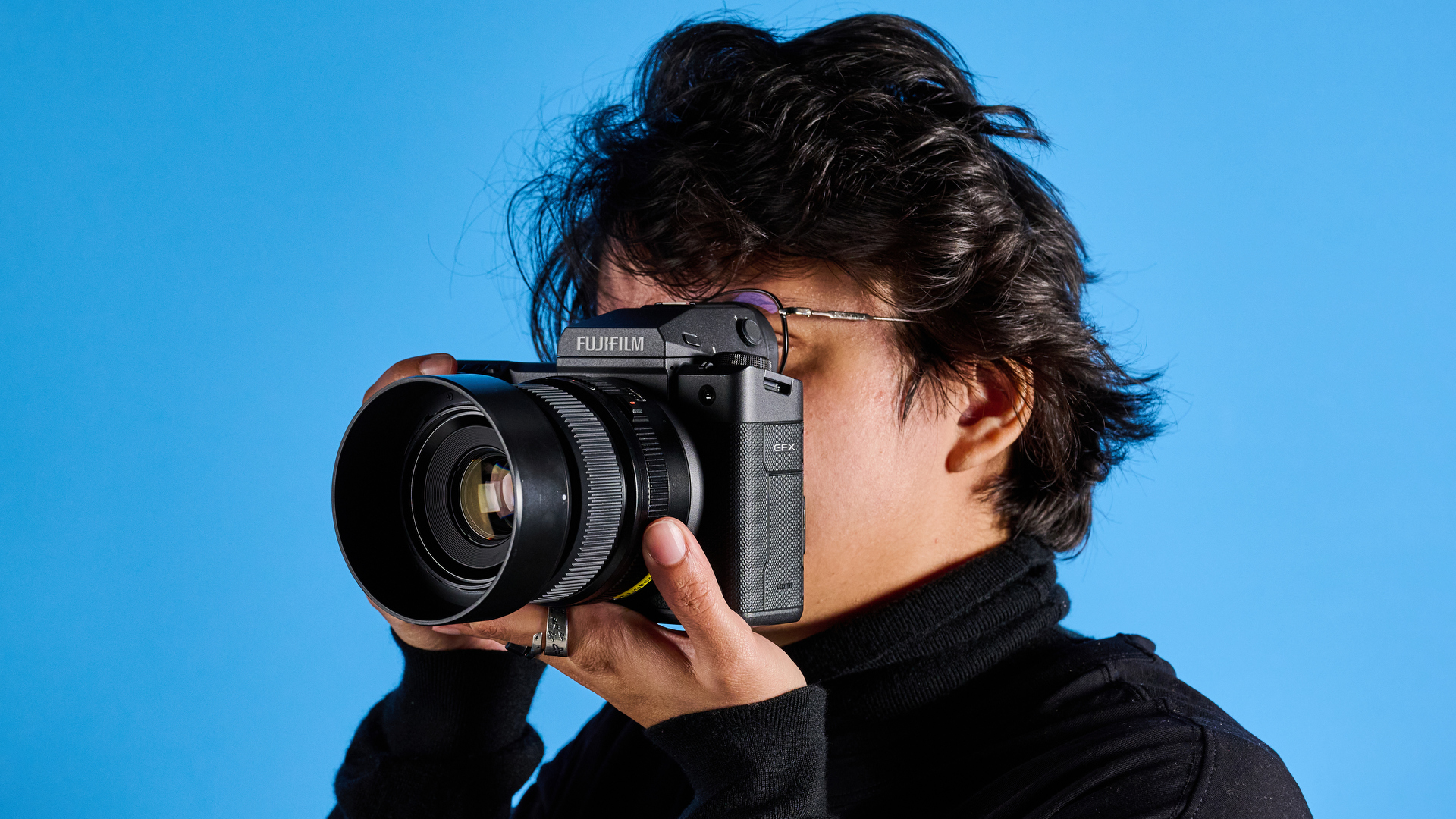 The Fujifilm GFX100 II being used by a photographer