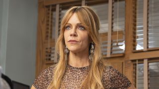 Morgan in leopard print top staring at Captain in High Potential