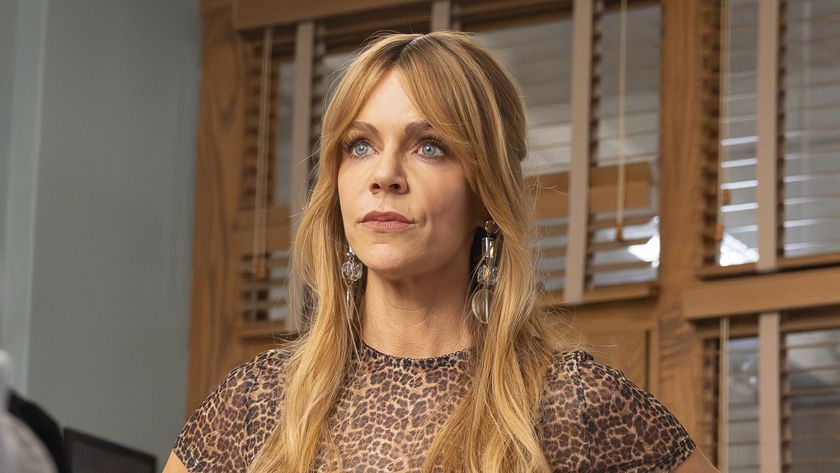 Morgan in leopard print top staring at Captain in High Potential