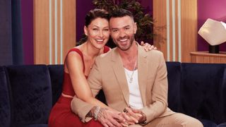 Matt and Emma Willis sitting on a sofa holding hands for Love is Blind UK series two