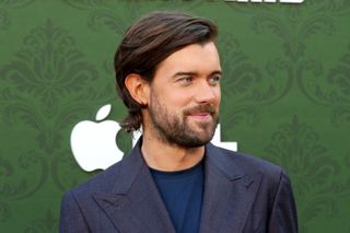 Jack Whitehall posing at an event