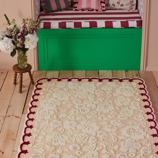 A floral scalloped rug from the Cath Kidston homeware collection on hard wood flooring