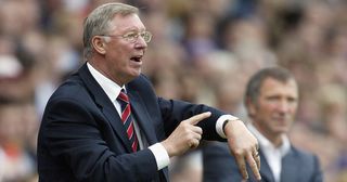 Sir Alex Ferguson, the Manchester United manager, tells the referee to check his watch during the FA Barclays Premiership match between Blackburn Rovers and Manchester United at Ewood Park on August 28, 2004 in Blackburn, England.