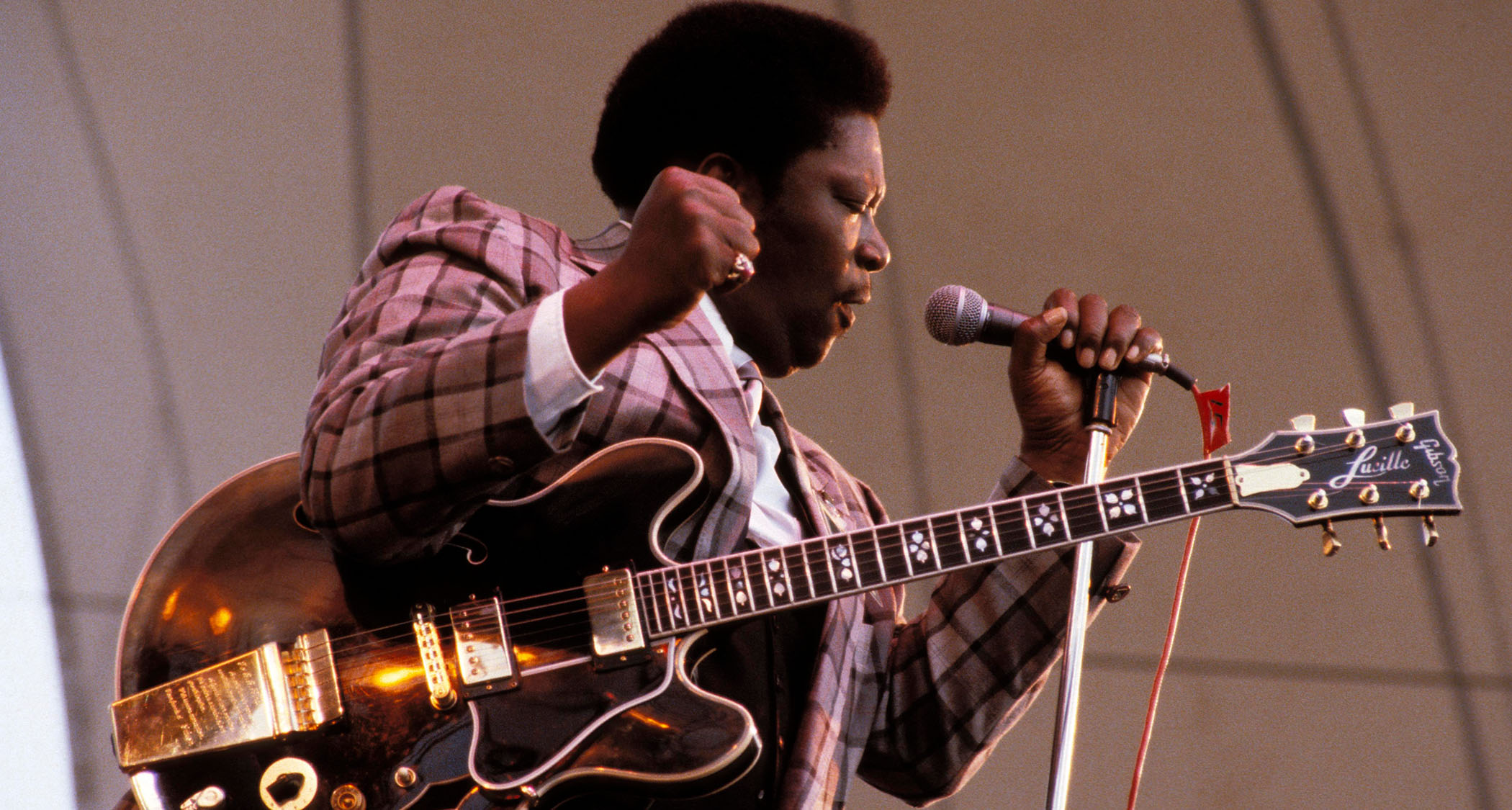 B.B. King pumps his fist as he performs with Lucille in 1979