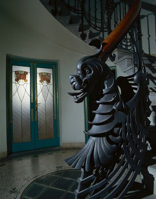 Metal dragon detailing on a staircase