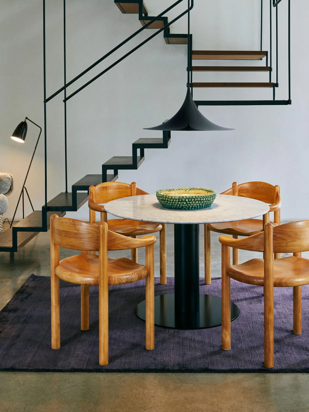 Wood dining chairs in a styled dining room