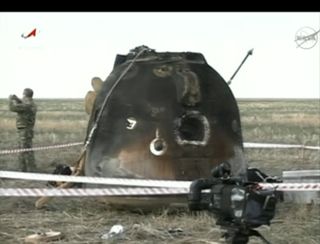 The Soyuz TMA-04M spacecraft that landed the Expedition 32 crew on the steppes of Kazakhstan on Sept. 16, 2012 EDT (Sept. 17 local time) is seen after being hauled upright by recovery teams.