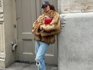 a woman in a furry jacket