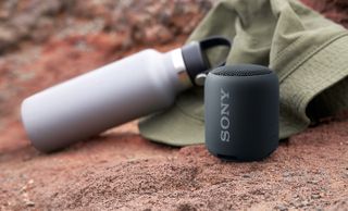 Sony Srs Xb12 Portable Wireless Speaker in an outdoor setting