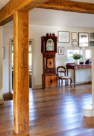 oak frame hallway with beams and antique grandfather clock