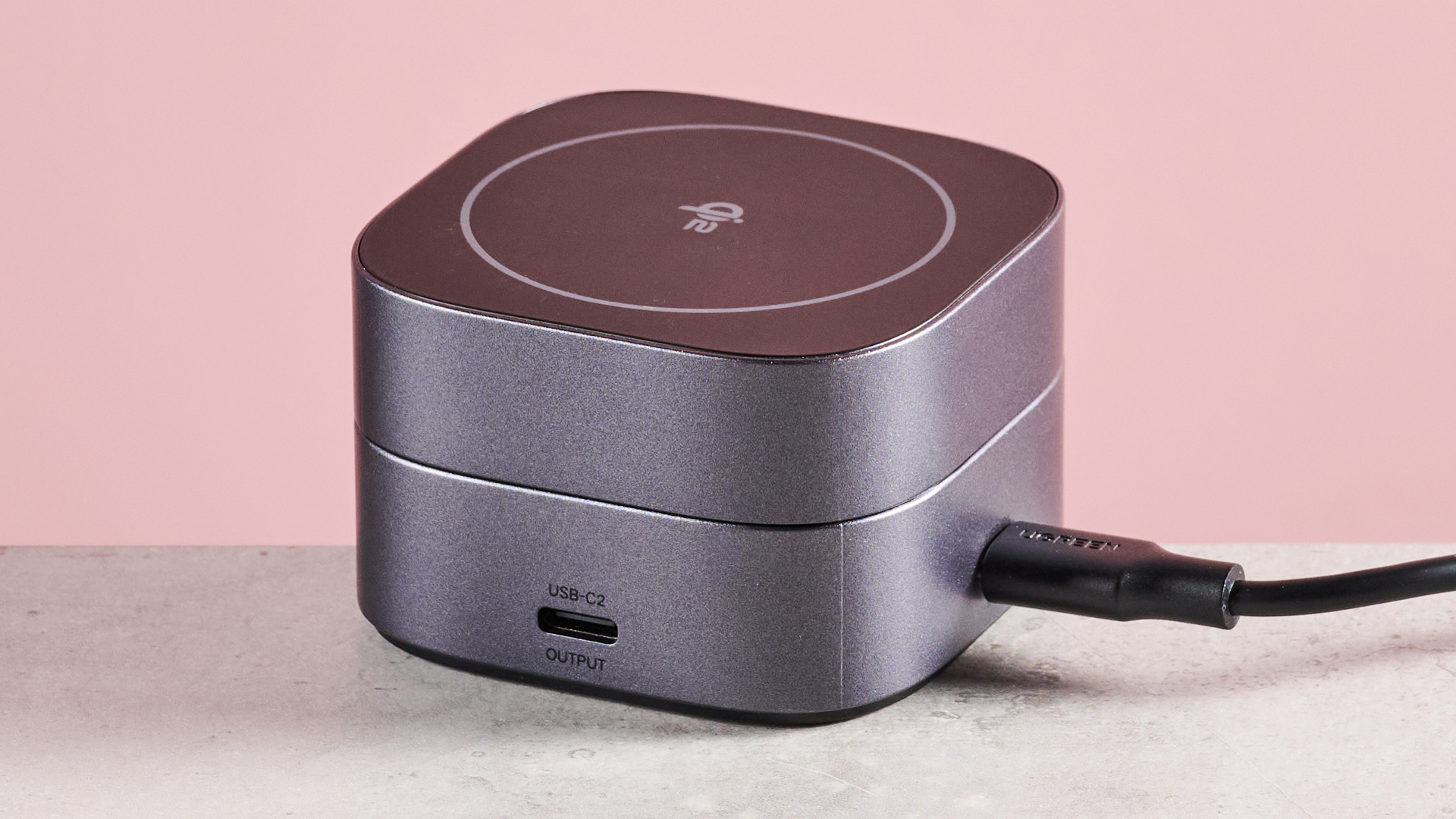 The 2-in-1 UGreen charger is folded down, the USB-C output can be seen on the side, and the USB-C power cable is plugged in at the back of the charger.